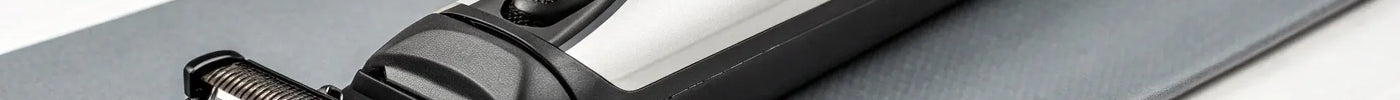 A set of magnetic Stylecraft Saber trimmer guards with the clipper.