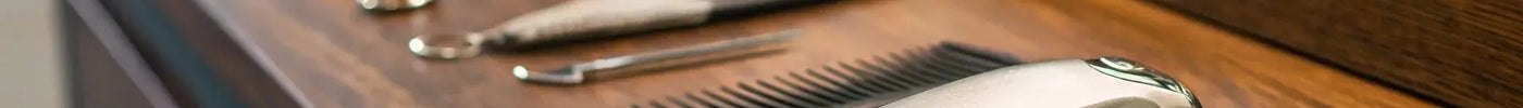 Andis UltraEdge AGC Super 2-Speed Clipper on a professional barber's workstation.
