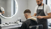Barber using a soft barber neck duster after a fresh fade