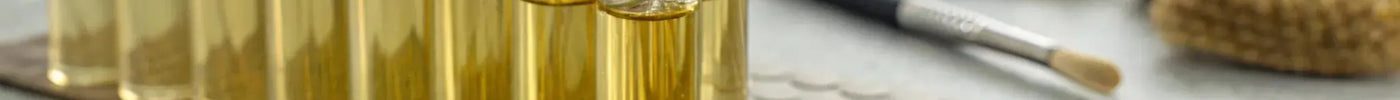 Bottles of professional barber clipper oil from various brands ready to buy wholesale.