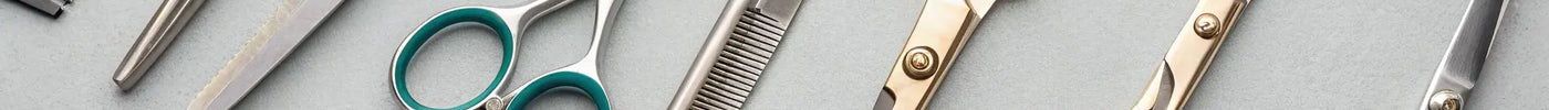 A professional set of discount barber shears and a matching comb.