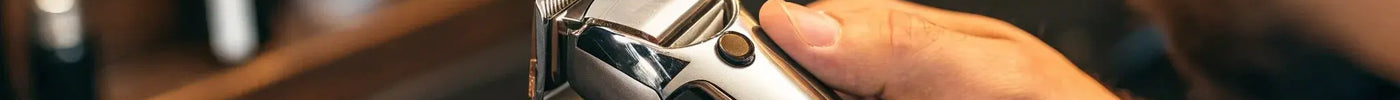A Wahl clipper with a close-up on the blade and lever for replacement.