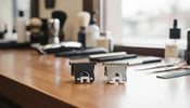 Professional barber trimmer blade on a barbershop counter with replacement blades