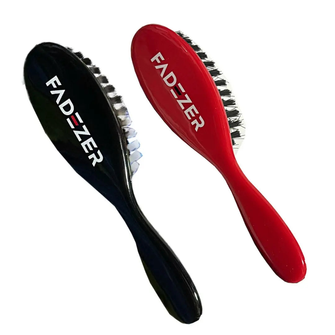 Two hairbrushes, one black and one red, with 'FAD-ZER' branding on a white background.