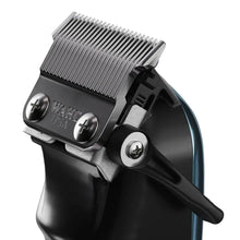 “Close-up of Stagger-Tooth T-blade blending thick hair with smooth taper.”