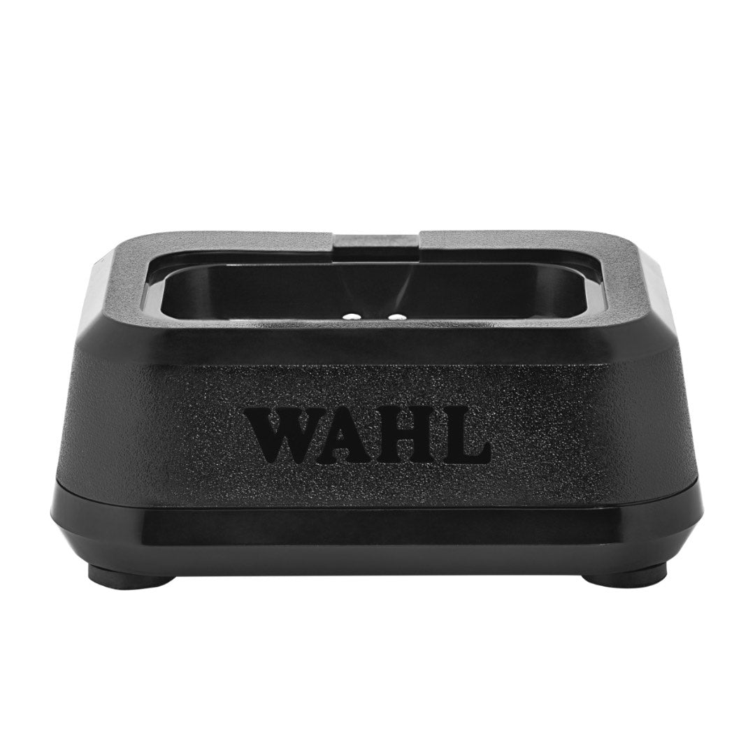 “Wahl Single Power Station dock with clipper insert attached on barbershop counter.”