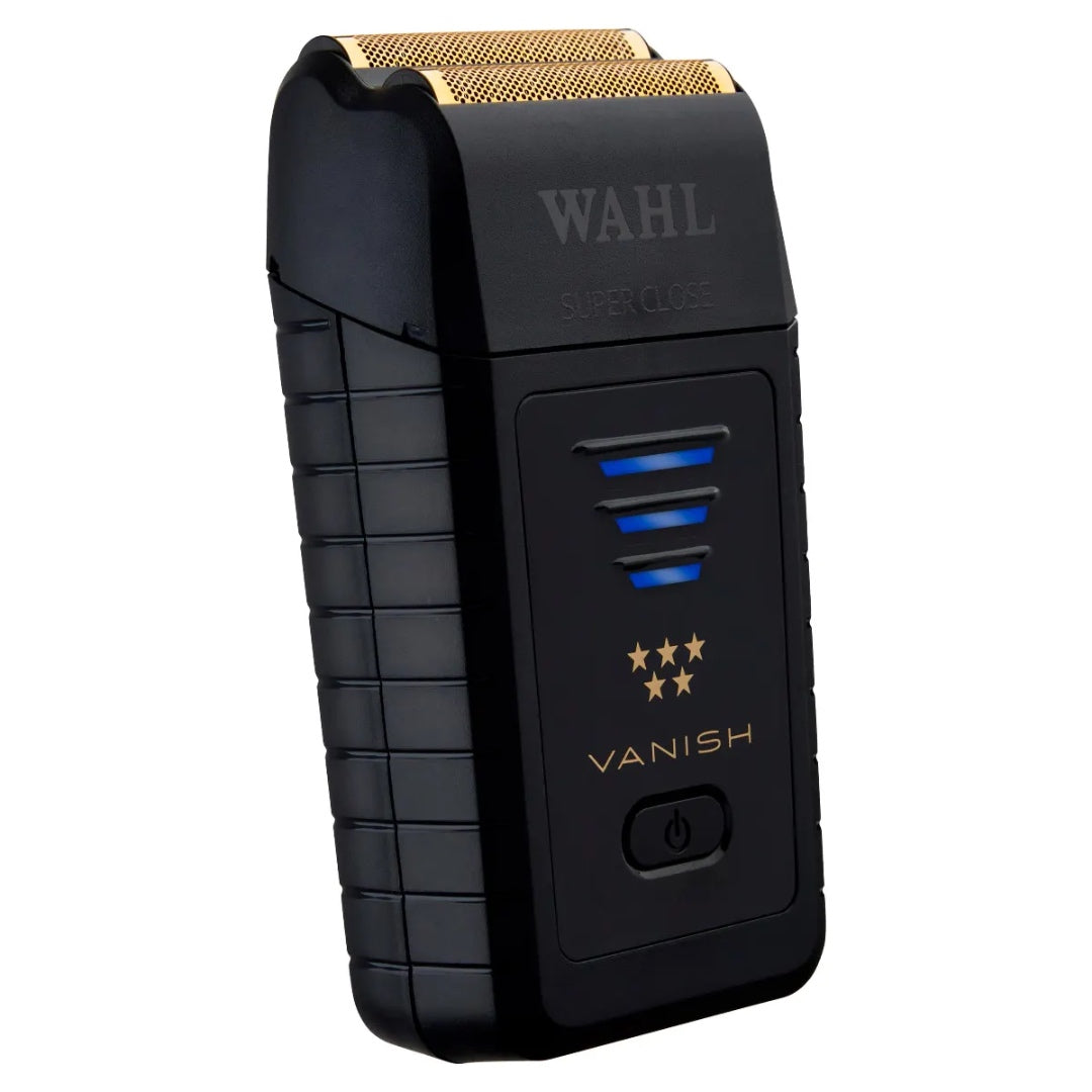 “Barber finishing a skin fade with Wahl Vanish foil shaver on client’s neckline.”