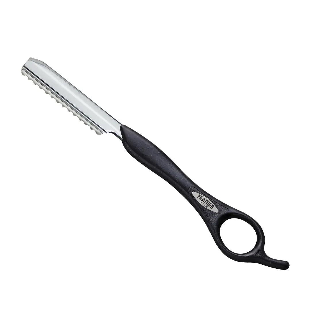 “Close-up of the guarded blade on the Feather Styling Razor ensuring safety and precision”