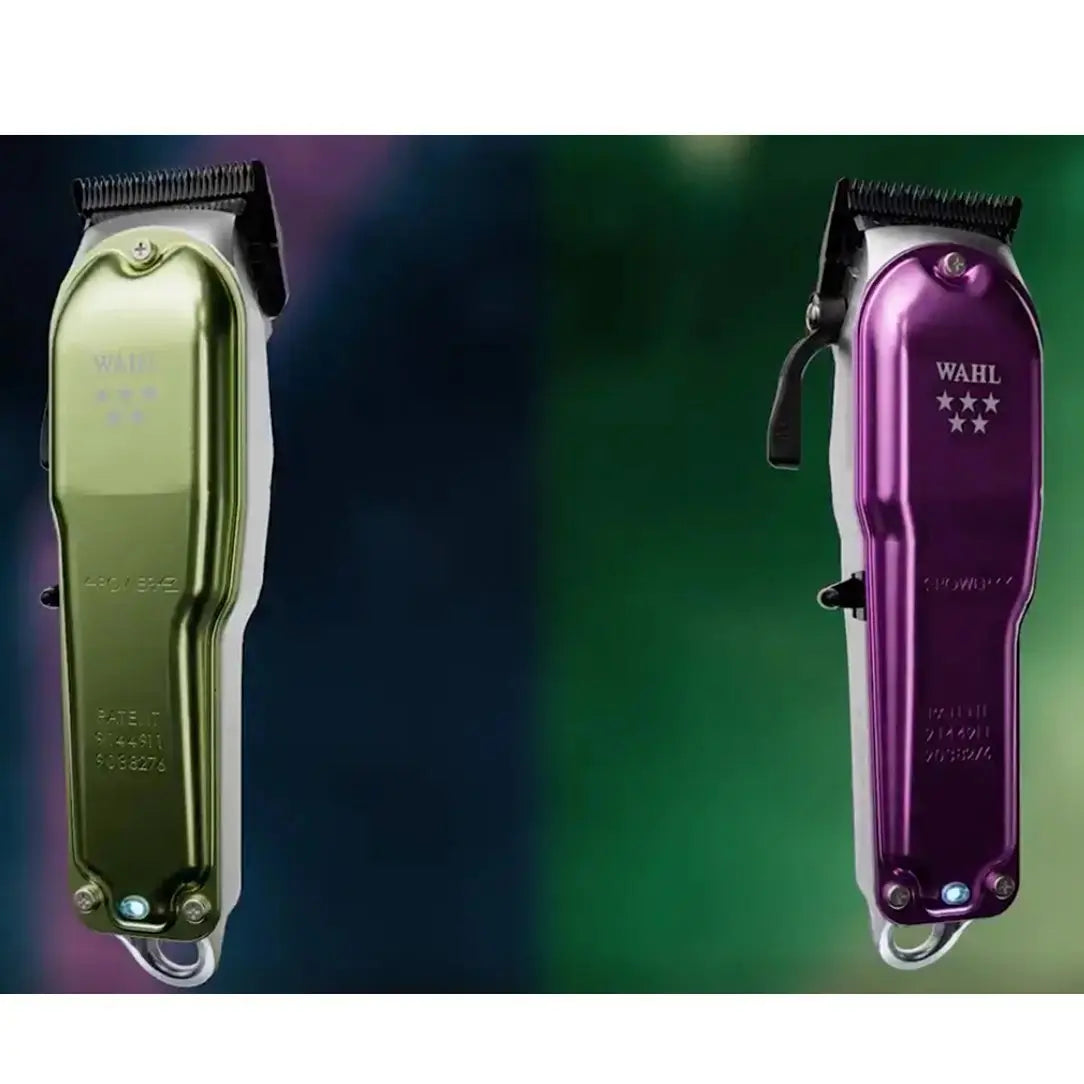 Two Wahl hair clippers, one gold and one purple, on a gradient background.