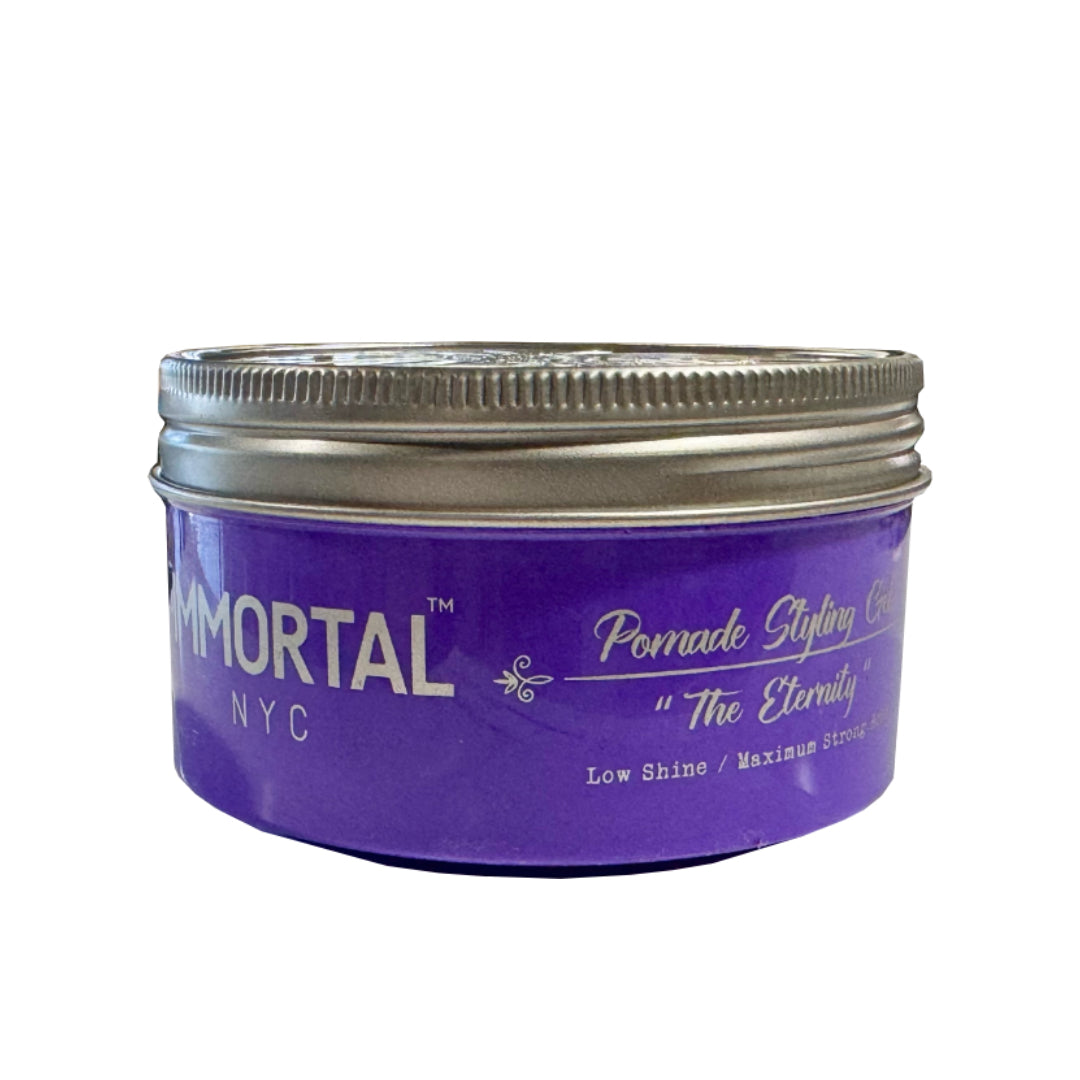 “Model shaping a textured pompadour with The Eternity Pomade Gel, achieving matte definition.”