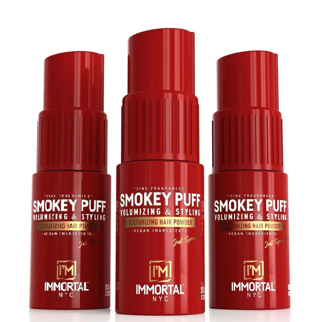 Three red bottles of Smokey Puff hair powder by Immortal NYC on a white background