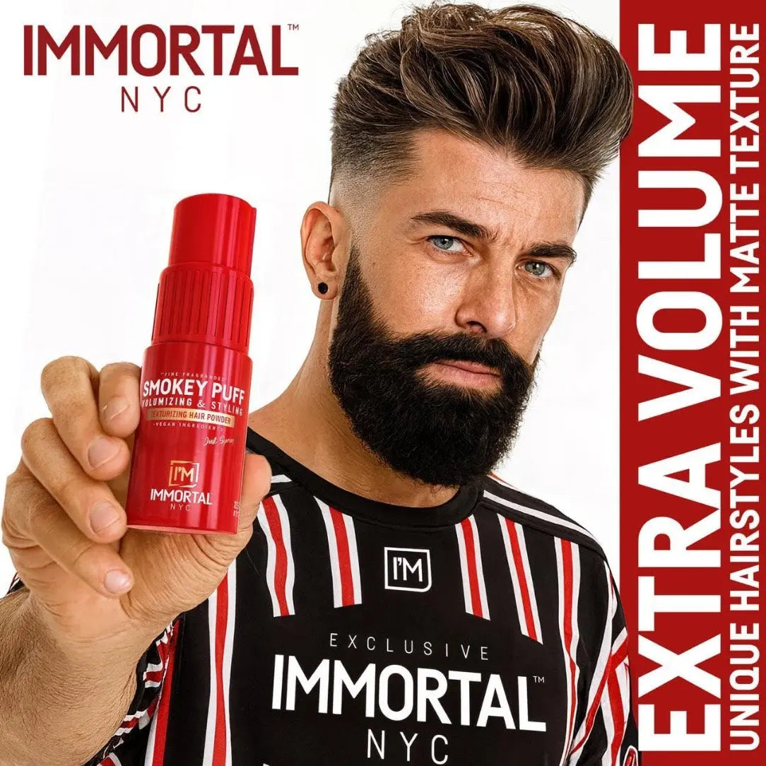 Man holding a red hair product with 'Immortal NYC' branding on a white background