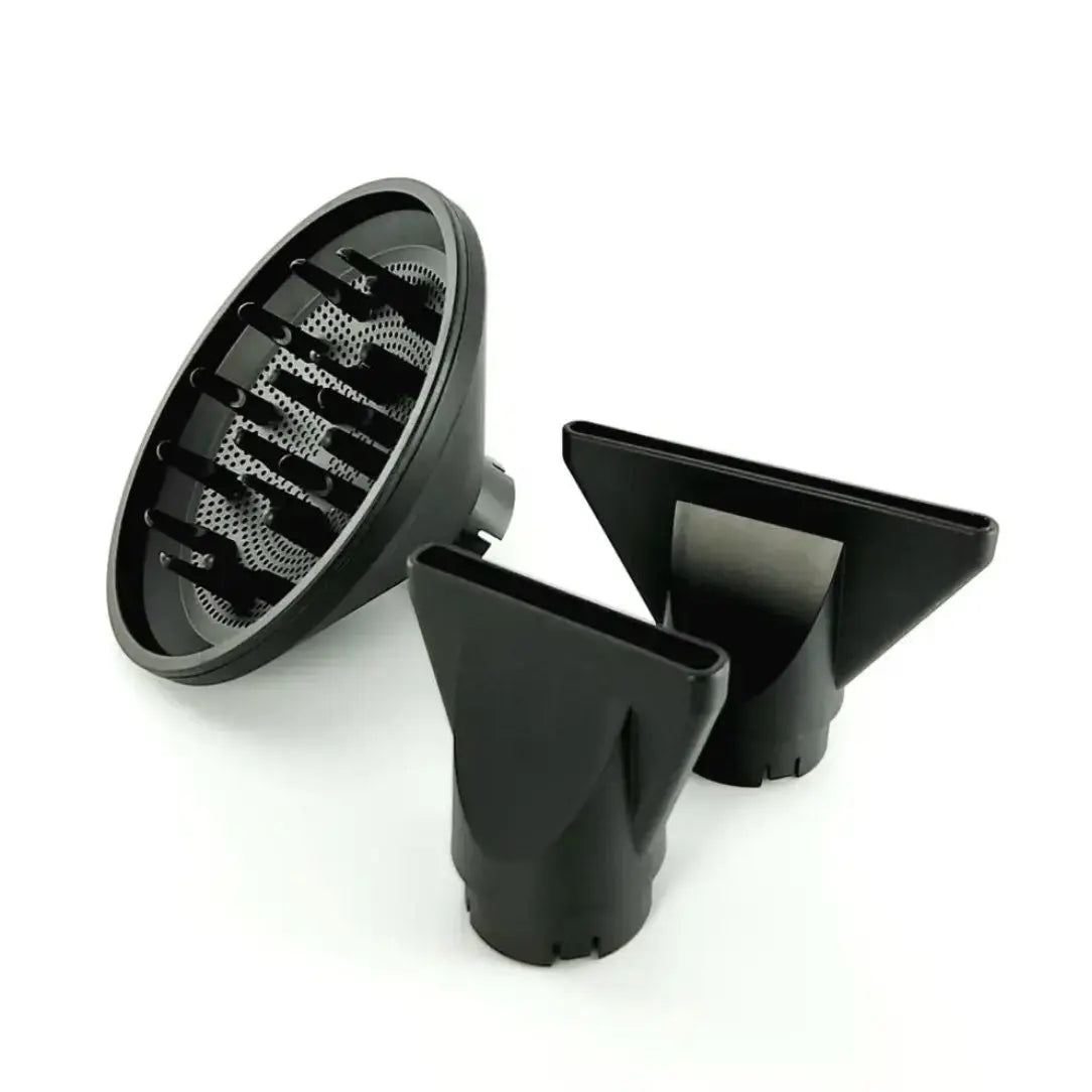 Set of black hair dryer attachments on a white background
