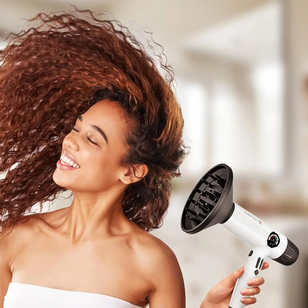 “Professional stylist using Instinct X hair dryer with concentrator nozzle in salon”