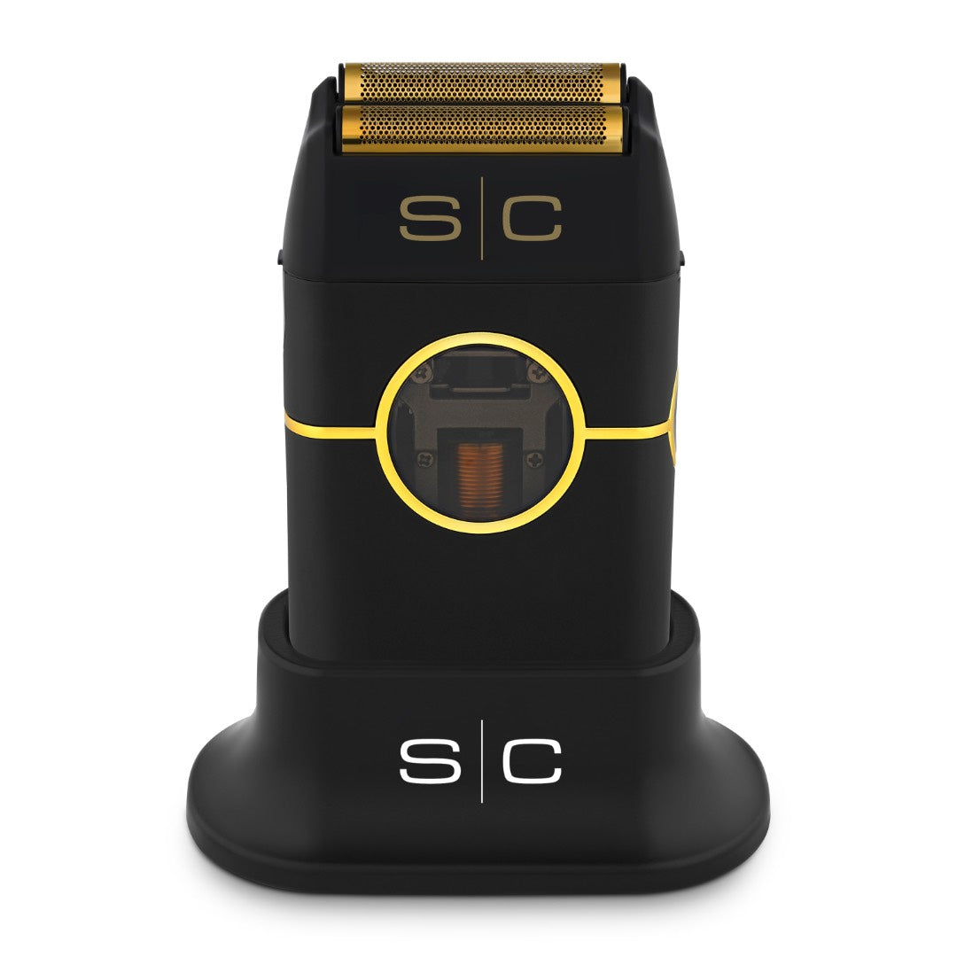 “Instinct Metal Shaver with gold titanium foils and dual cutters on charging base”