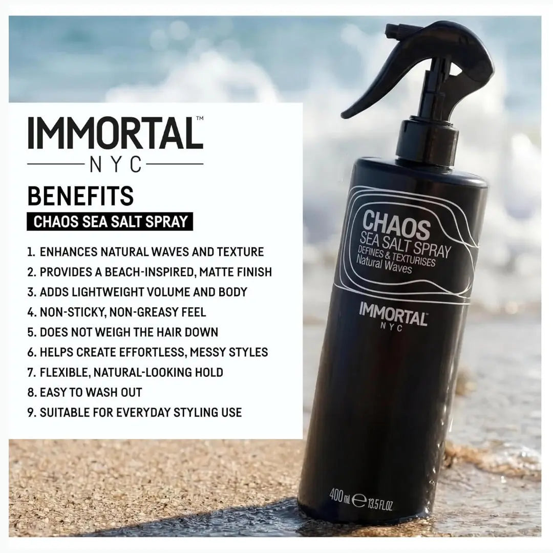 Black spray bottle labeled 'Chaos Sea Salt Spray' by Immortal NYC with beach background