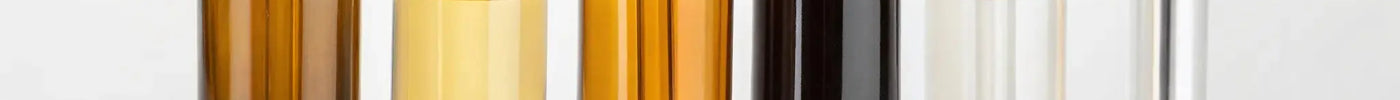 A selection of the best oils for professional hair clippers in dropper bottles.