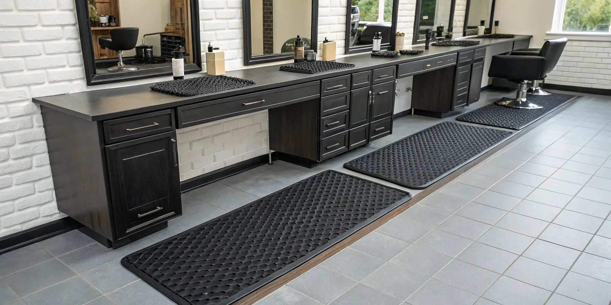 A professional barber station mat keeps clippers, combs, and scissors organized and ready for use.
