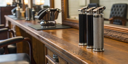 A lineup of the best professional clippers for barbers on a barbershop counter.