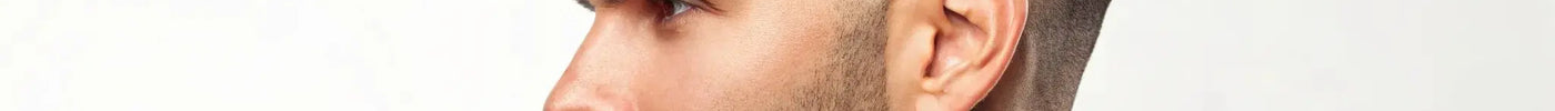 A modern fade haircut for men with a neatly trimmed beard.
