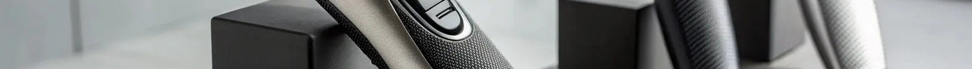 A collection of professional Andis beard trimmers known for their precision blades.