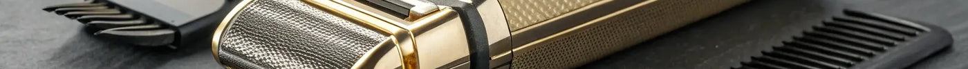 Gold Andis foil shaver with its precision barber blades and comb for a flawless finish.