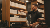 Professional barbershop backbar stocked with jars and canisters of styling powder