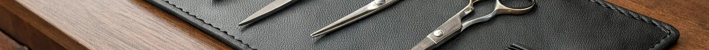 A barber's set of professional shears and a comb, key tools for choosing the right pair.