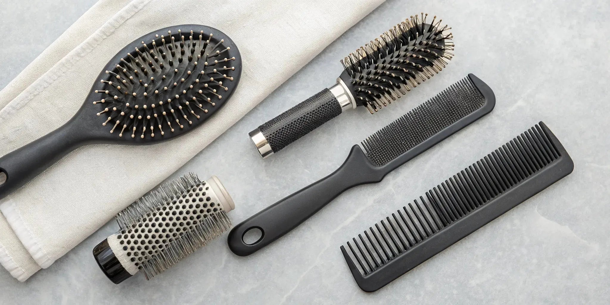 A variety of hair brushes for different hair types and styling goals.