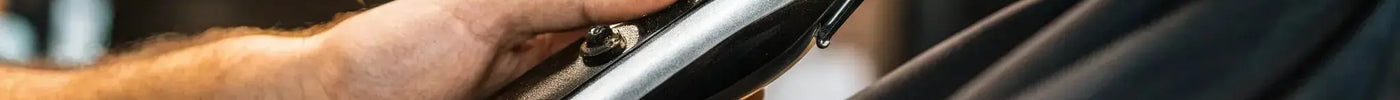 Barber using pro cordless clippers for a precise haircut.