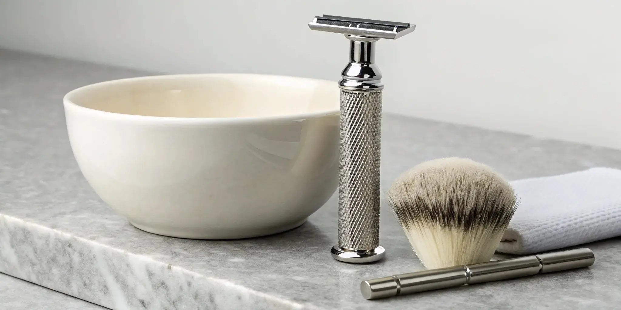 A beginner's single blade razor set with a shaving brush and bowl.