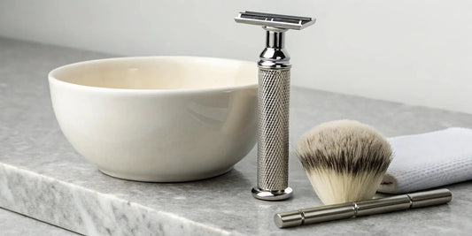 A beginner's single blade razor set with a shaving brush and bowl.