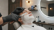 Professional barber performing a controlled straight razor shave