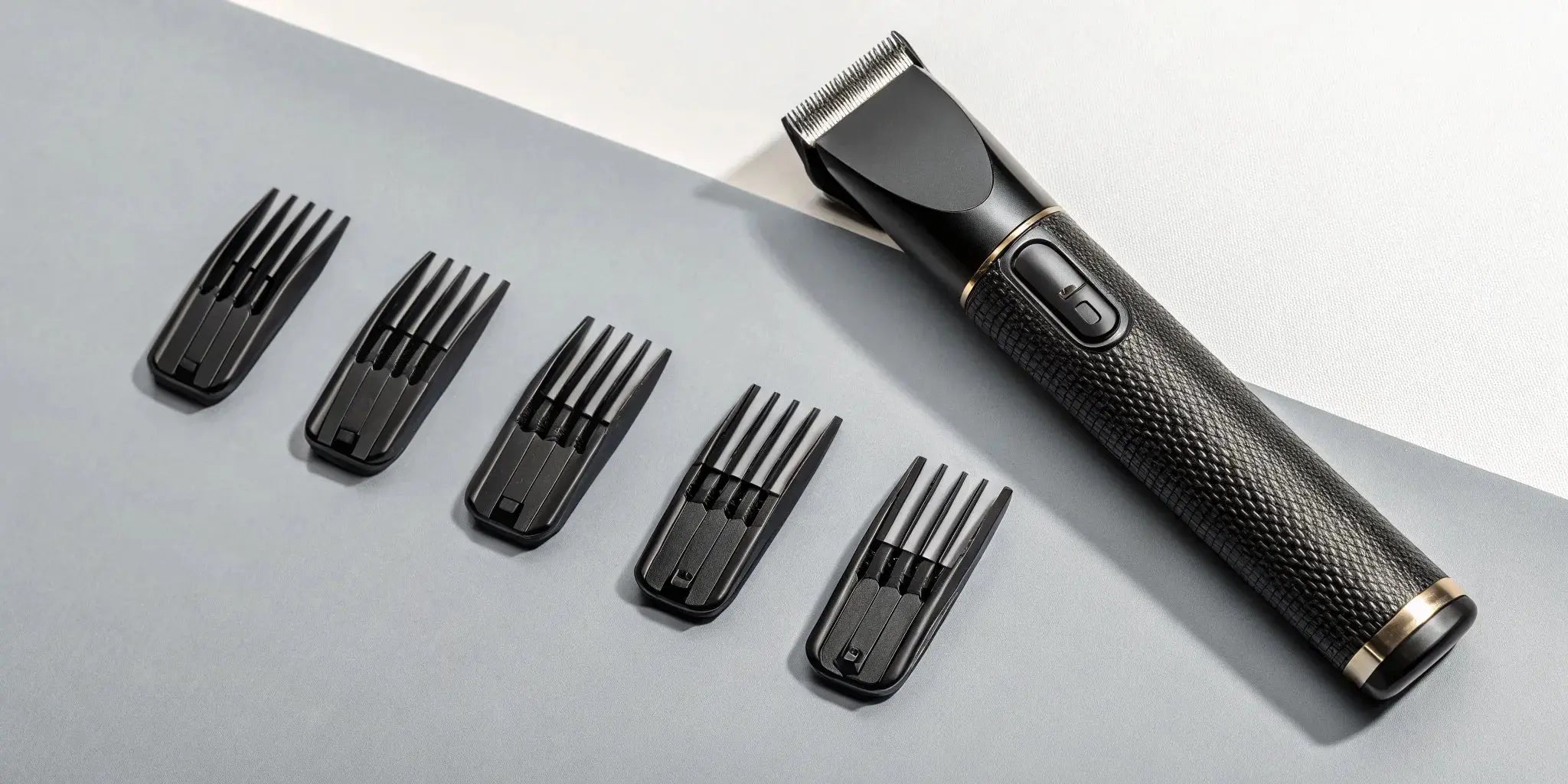 A Stylecraft clipper with its set of magnetic guards in various sizes.