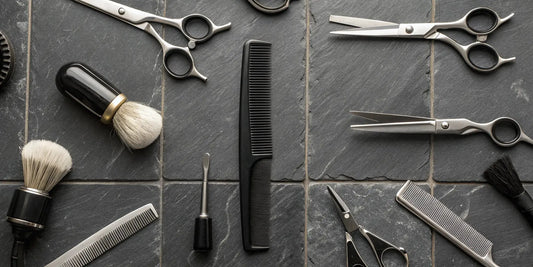 Professional barber supply tools including shears and combs arranged on a barber station.