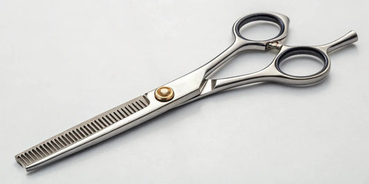 Texturizing shears with a notched blade used for adding texture and blending layers.