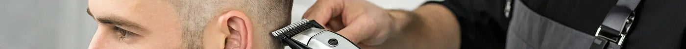 A barber using the Wahl Cordless Barber Combo to create a sharp fade.