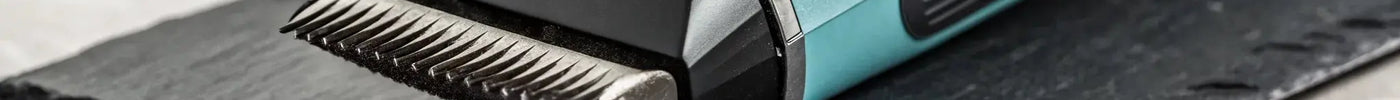 Close-up of a professional deep tooth trimmer blade for cutting thick, coarse hair.