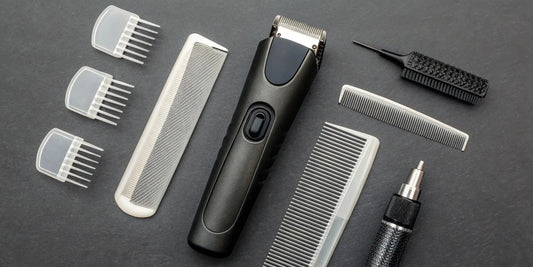 A clipper and trimmer maintenance kit with essential tools like a cleaning brush and blade oil.