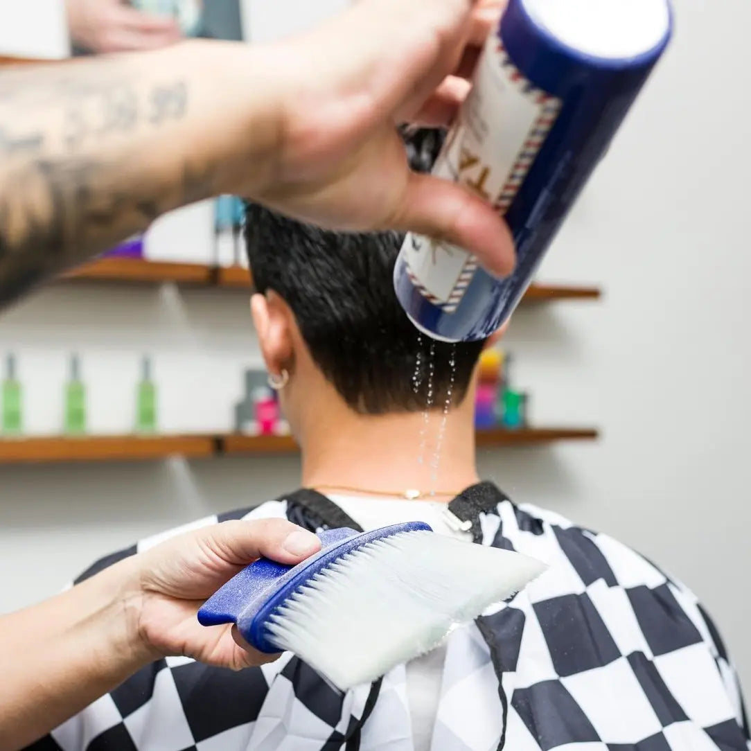 “Close-up of Johnny B. Barber Talc—fine dusting powder for post-shave comfort.”