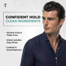 Gentlemen Republic Man wearing a navy shirt with text about product features on a light gray background