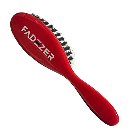 Red hairbrush with 'FADEZER' branding on a white background