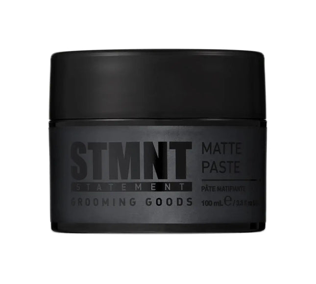 “STMNT Grooming Goods Matte Paste 3.38 oz jar on white background”

