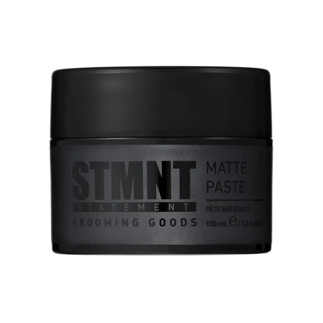 “STMNT Grooming Goods Matte Paste 3.38 oz jar on white background”

