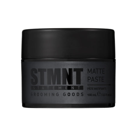 “STMNT Grooming Goods Matte Paste 3.38 oz jar on white background”

