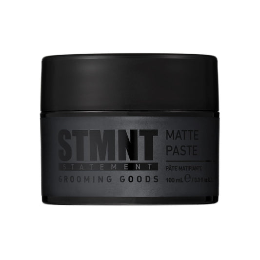 “STMNT Grooming Goods Matte Paste 3.38 oz jar on white background”

