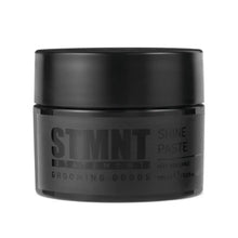 Black jar of STMNT Shine Paste on a white background