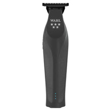 Black Wahl grooming tool on a white background