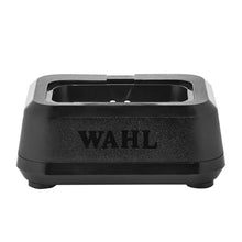 “Wahl Single Power Station dock with clipper insert attached on barbershop counter.”

