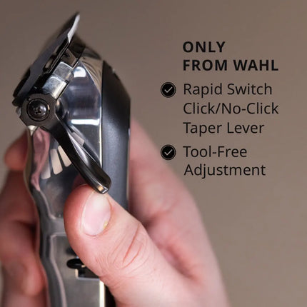 Hand holding a Wahl Senior 2.0 Clipper Cordless/Corded  grooming tool with features highlighted on a plain background